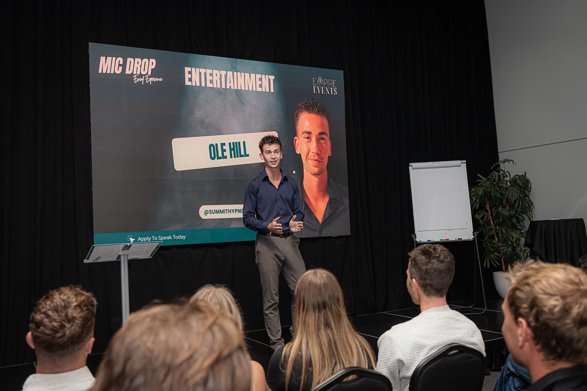 Ole Hill speaking on stage